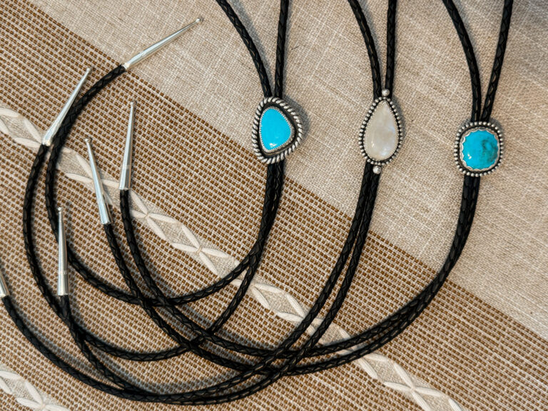 Handmade sterling silver turquoise and moonstone bolo ties on braided black leather cords