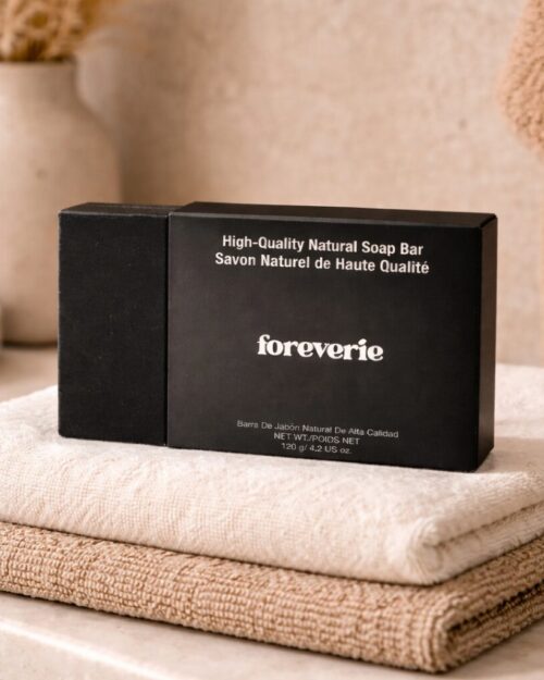 Foreverie matte black natural soap box displayed in a minimalist spa setting with warm neutral tones