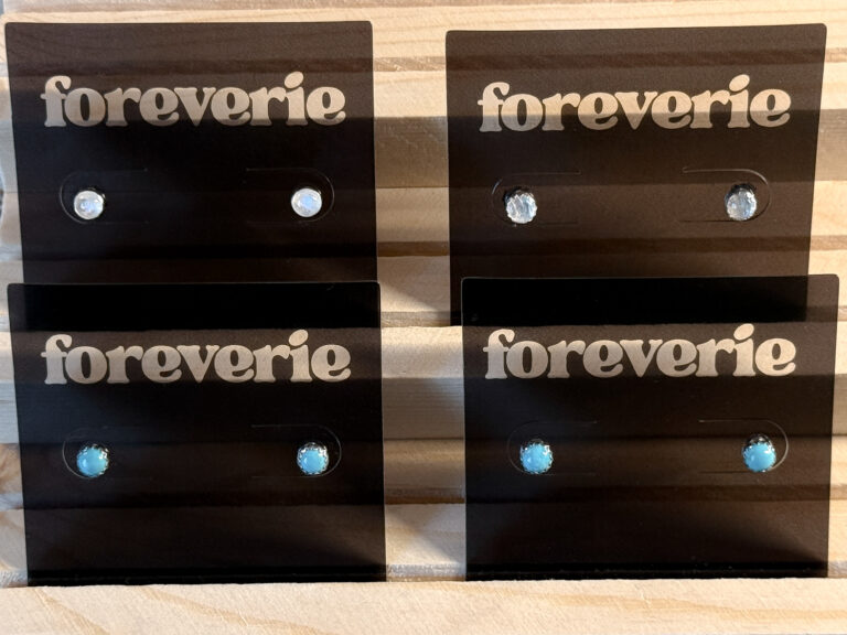 Foreverie branded stud earrings featuring sterling silver settings with turquoise and moonstone stones