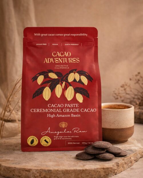 Ceremonial grade cacao pouch from the High Amazon Basin styled with cacao discs and a warm ceramic cup on a neutral earthy background