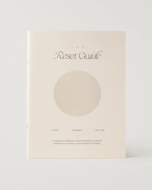 The Reset Guide reflective workbook with minimal neutral cover design.