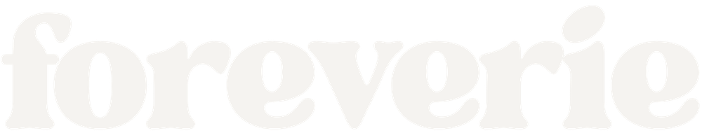 Foreverie logo in soft cream serif lettering on a transparent background