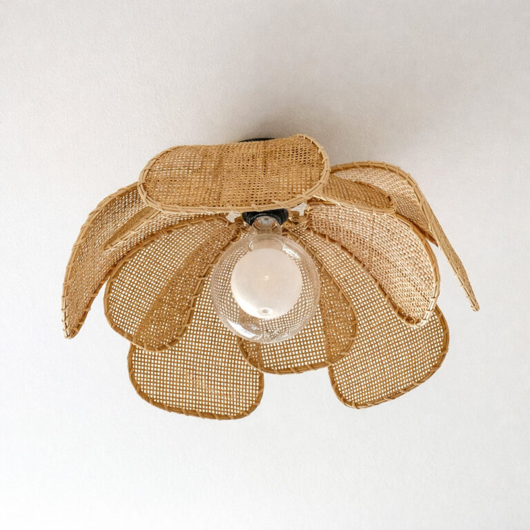 rattan flower flush mount ceiling light with frosted globe bulb in a cozy feminine space